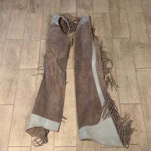 Real cowgirl ass-less chaps. Brand is unknown. Would fit a size small. Very long